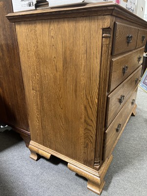 Lot 700 - Oak chest of drawers and two matching bedside sets of drawers