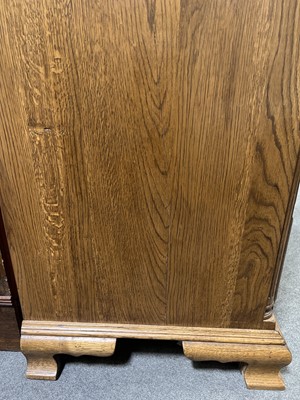 Lot 700 - Oak chest of drawers and two matching bedside sets of drawers