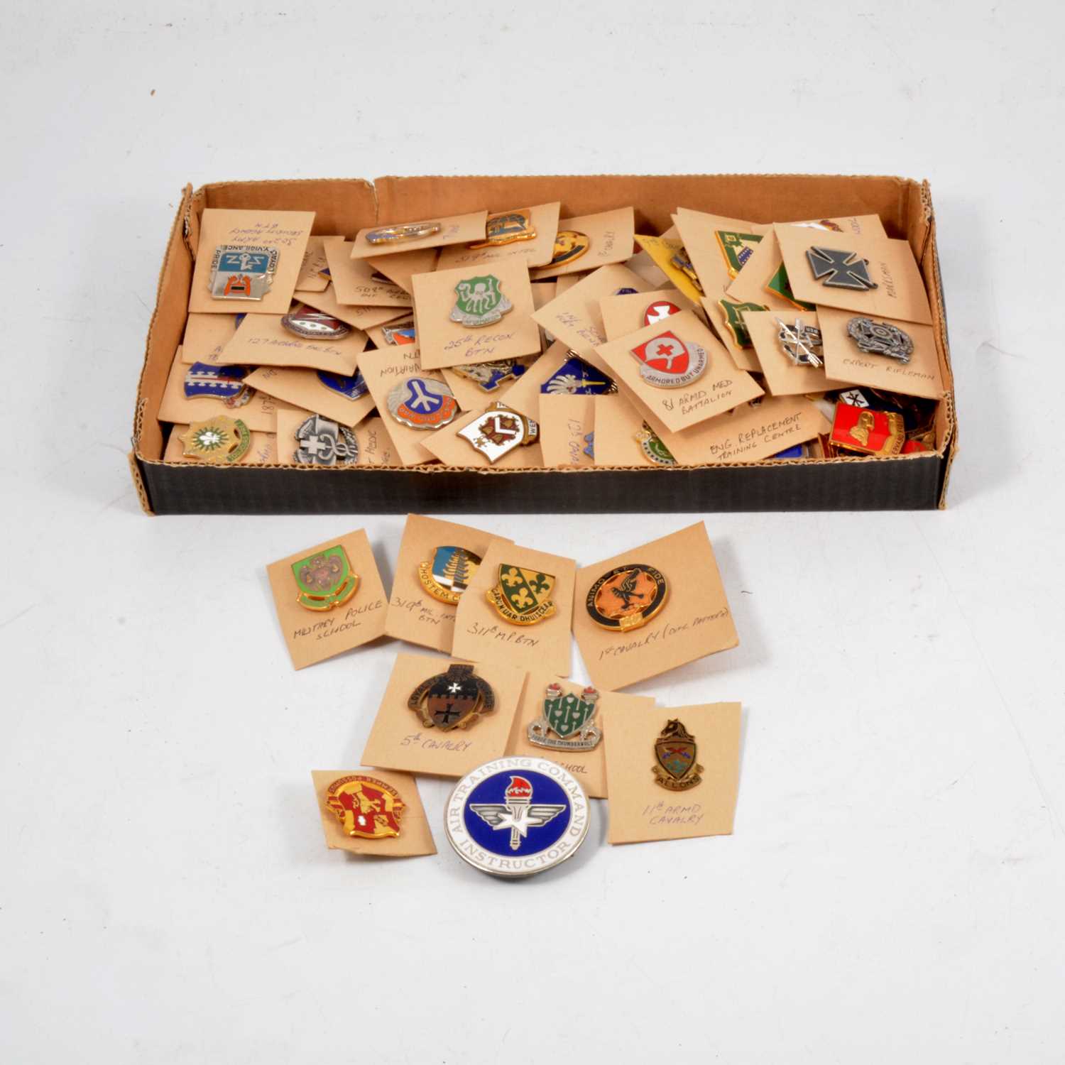 Lot 256 - Seventy-three US military enamel division badges.