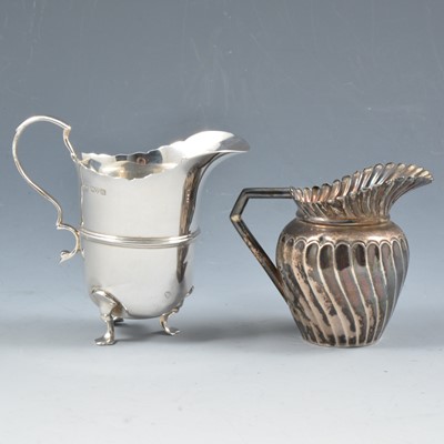 Lot 255 - Two silver cream jugs