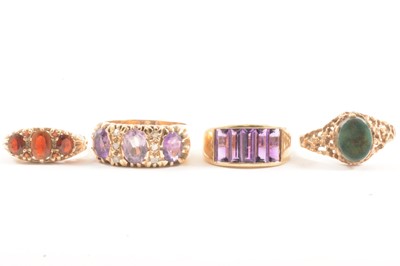 Lot 111 - Four gemset dress rings.