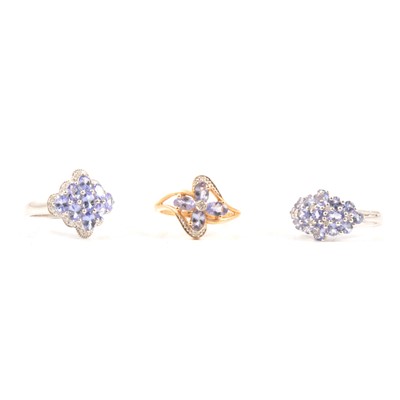 Lot 63 - Three tanzanite and diamond 14 carat gold rings.