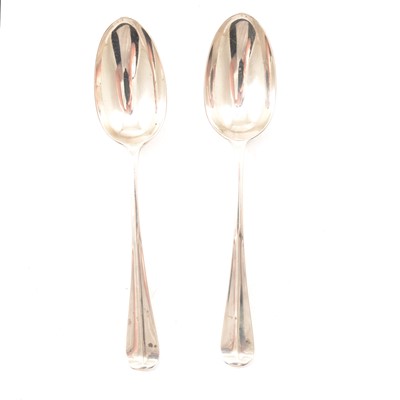 Lot 275 - A pair of silver rat tail table spoons.