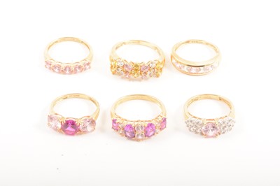 Lot 121 - Six modern multi-colour cubic zirconia rings.