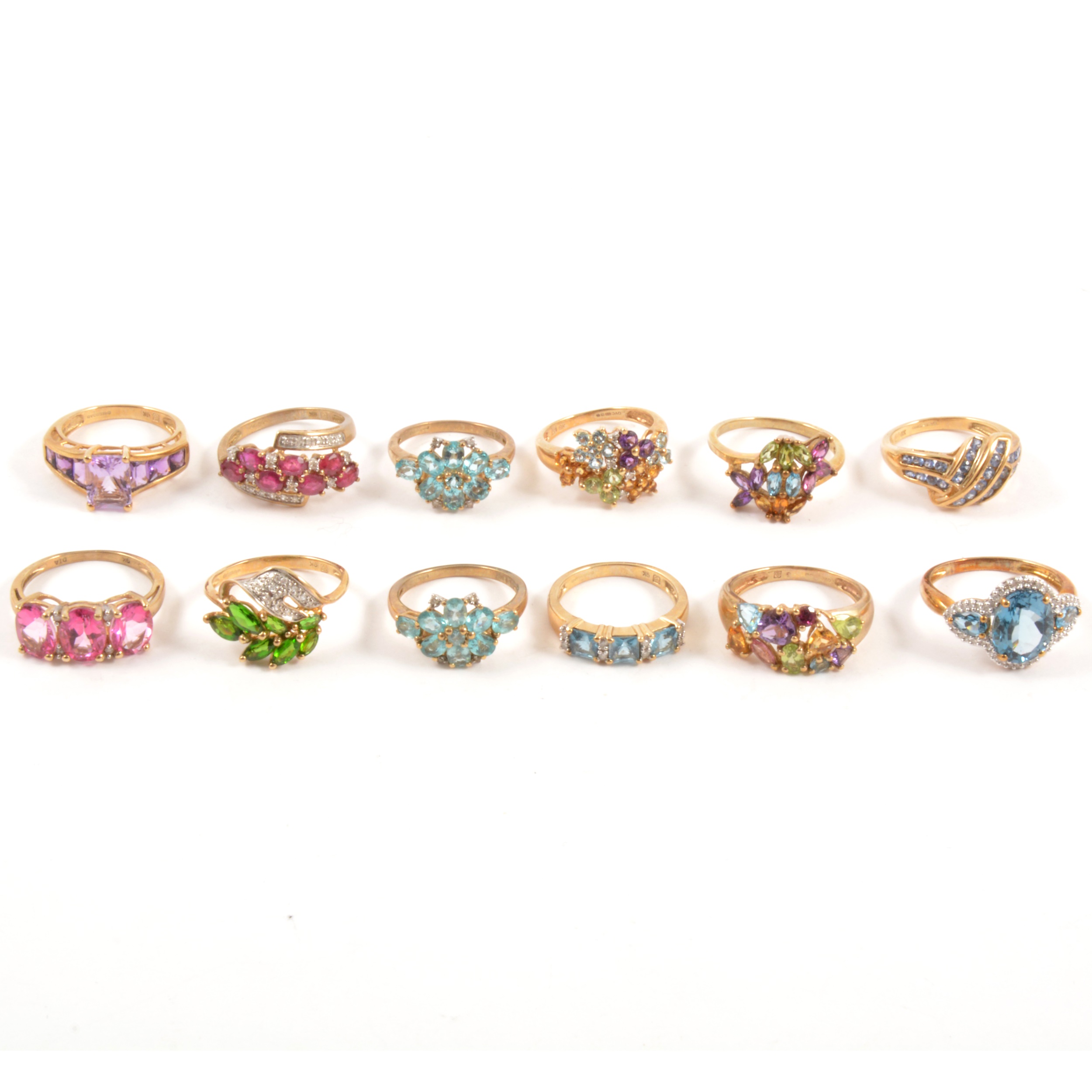 Lot 122 - Twenty modern gemset 9 carat gold rings.