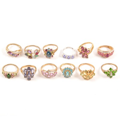 Lot 124 - Eighteen modern gemset 9 carat gold rings.