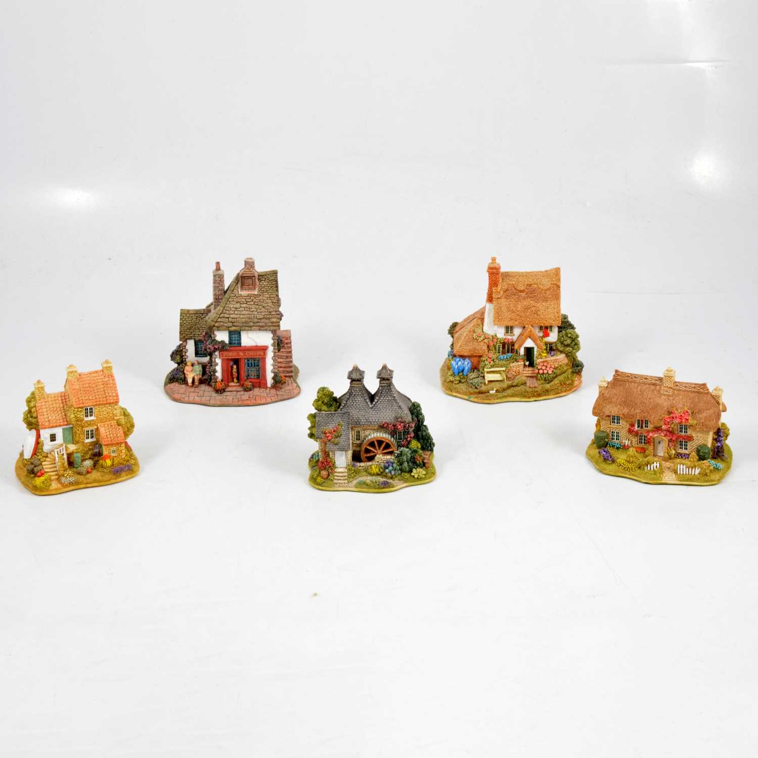 Lot 80 - Nine small Lilliput Lane models and two binders for magazines.