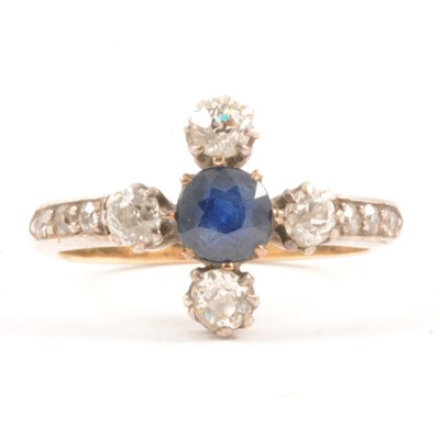 Lot 51 - A sapphire and diamond ring.