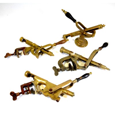 Lot 75 - Four brass bar top corkscrews
