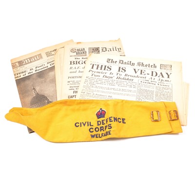 Lot 296 - Box of World War Two newspapers and two Civil Defense Corps Welfare arm bands