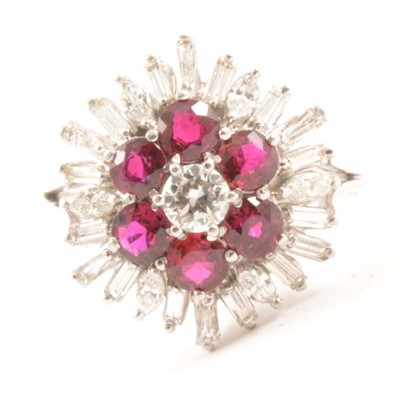 Lot 65 - A ruby and diamond cluster ring
