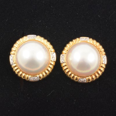 Lot 162 - A pair of pearl and diamond earrings.