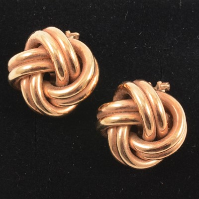 Lot 164 - A pair of knot design earrings.