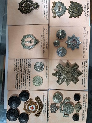 Lot 144 - Approx. sixty-five mainly WW2 military cap badges, and other items.