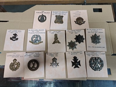 Lot 145 - Approx. 80 WW1 military cap badges, lapel badges, and buttons.