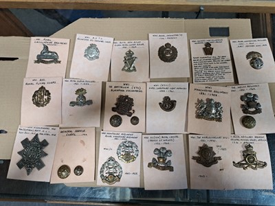 Lot 145 - Approx. 80 WW1 military cap badges, lapel badges, and buttons.