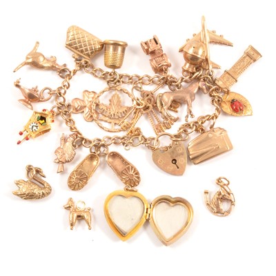 Lot 194 - A 9 carat yellow gold charm bracelet and charms