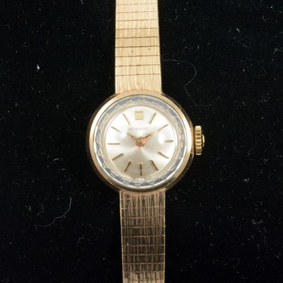 Lot 386 - Tissot - a lady's 9 carat yellow gold bracelet watch.