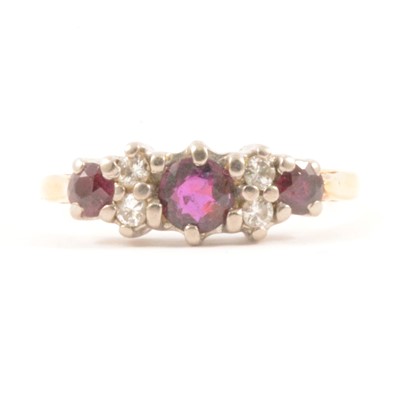 Lot 68 - A ruby and diamond ring.