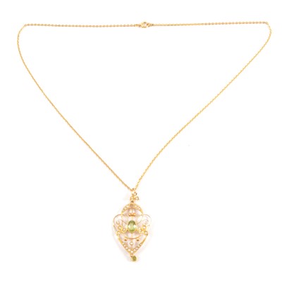 Lot 237 - A peridot and seed pearl pendant and chain.