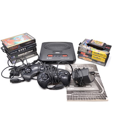 Lot 280 - Sega Mega Drive II games console, with cables, two controllers, eight games