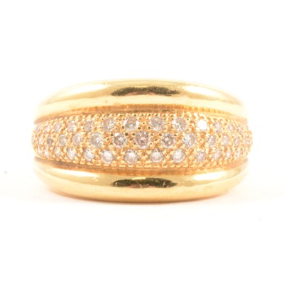 Lot 13 - A diamond set half hoop ring.