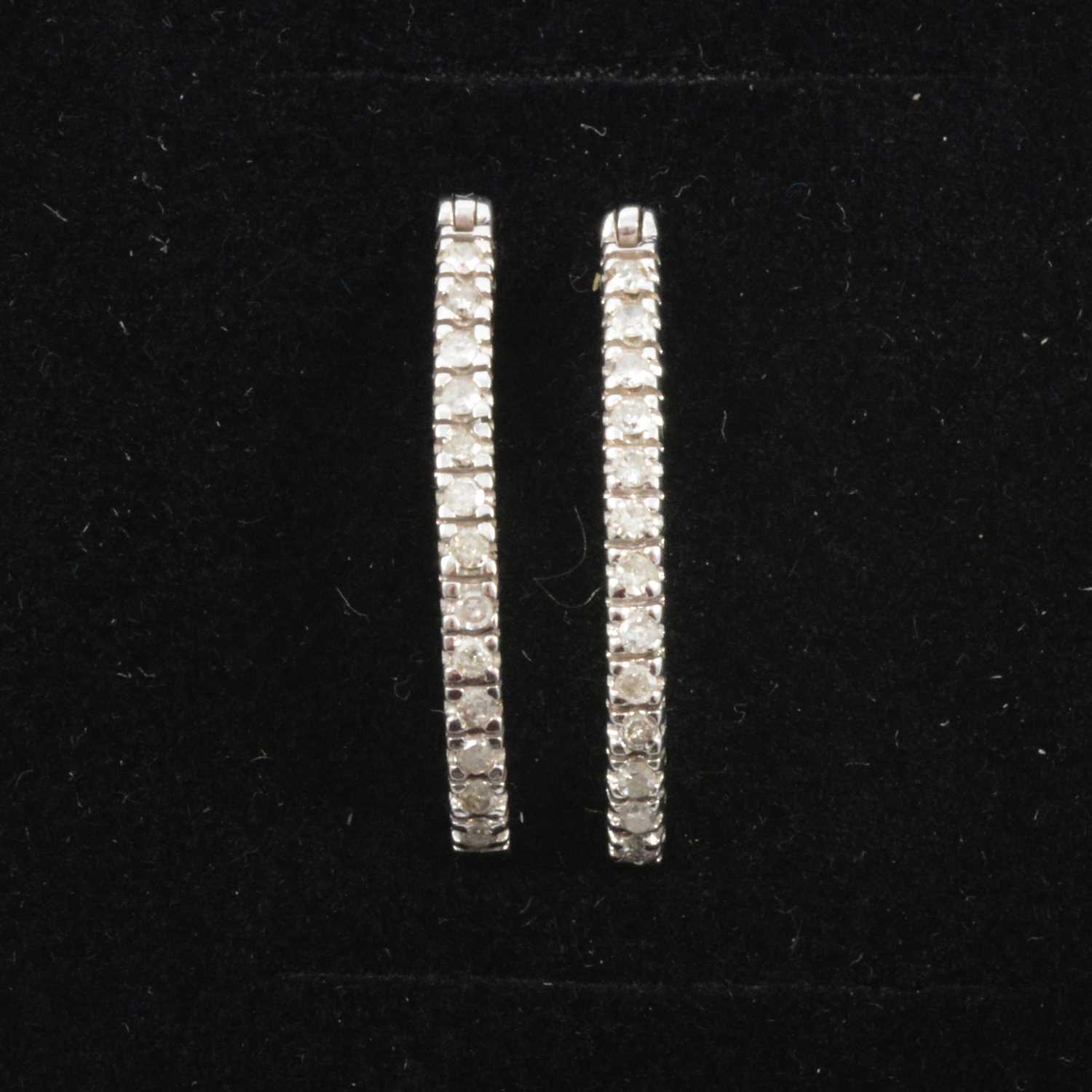 Lot 162 - A pair of diamond hoop earrings