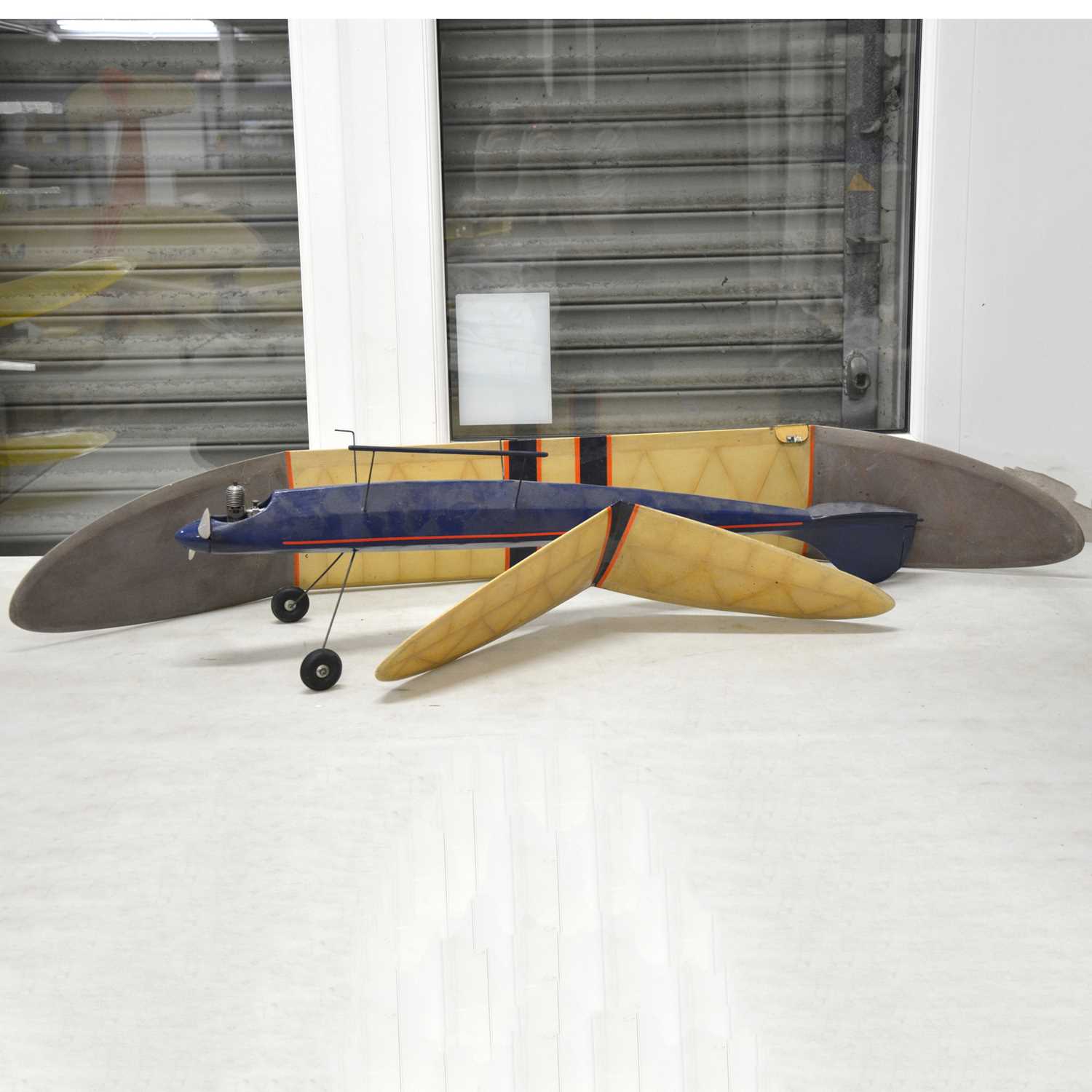 Lot 499 - Blue v-tail model aircraft