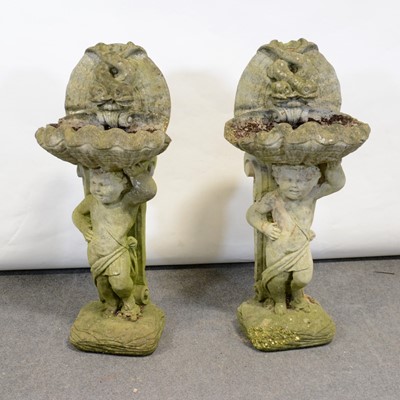 Lot 505 - Pair of reconstituted stone garden cherub bird baths