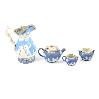 Lot 54 - Wedgwood blue jasper ware three-piece teaset; and a blue ground Parian jug.