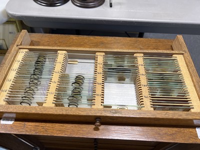 Lot 177 - Early 20th century oak microscope slide cabinet, with a large quantity of slides