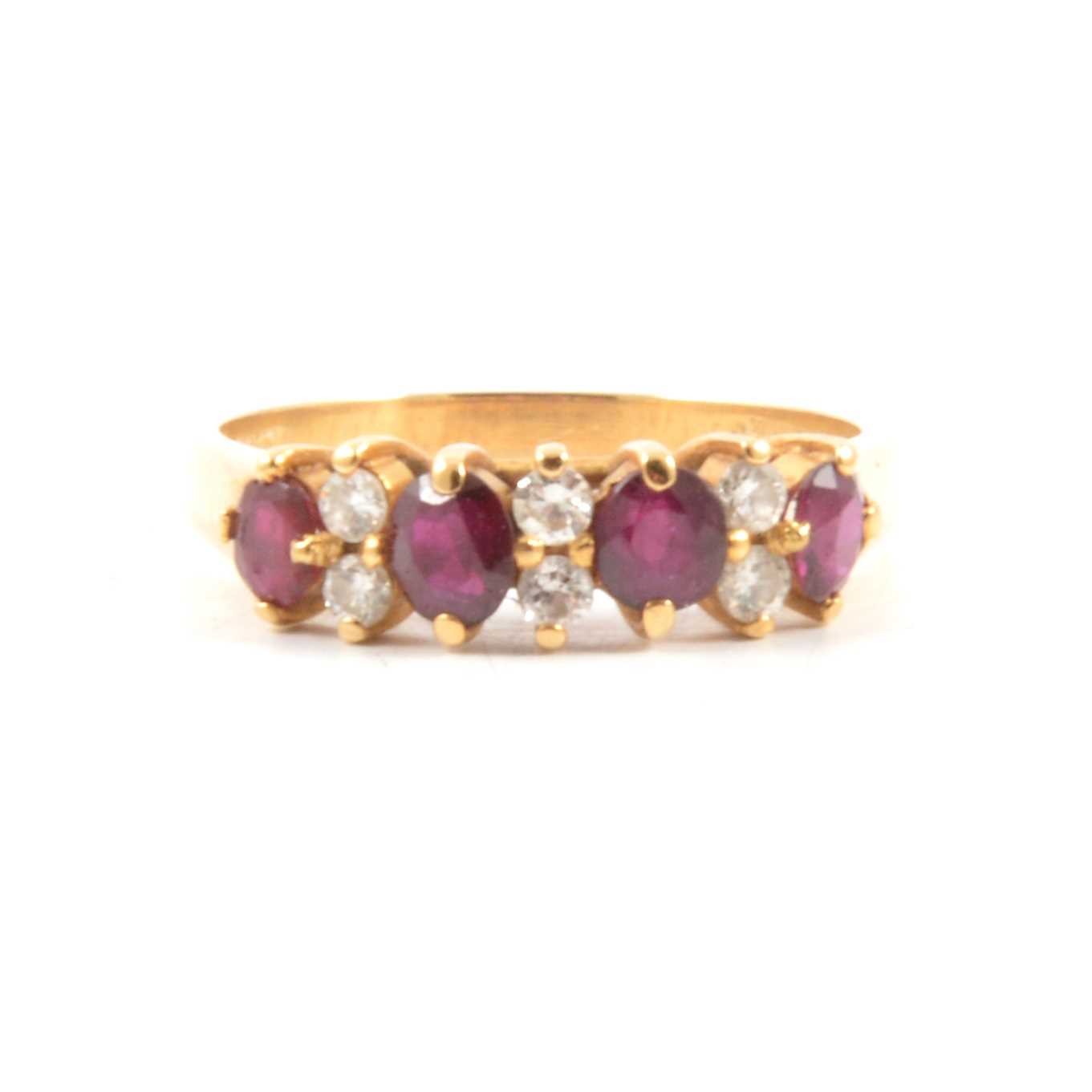 Lot 67 - A ruby and diamond half hoop ring.