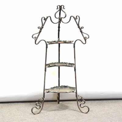 Lot 323 - Arts & Crafts copper and iron three-tier stand