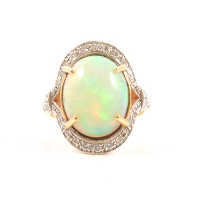 Lot 76A - An opal and diamond cluster ring.