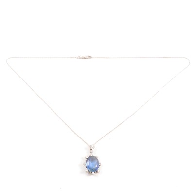 Lot 227A - A sapphire and diamond pendant.