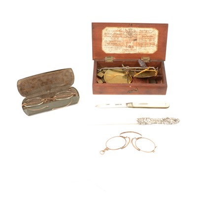 Lot 373A - Yellow metal spectacles, folding pince nez, fruit knife, page turner, and apothecary scales.