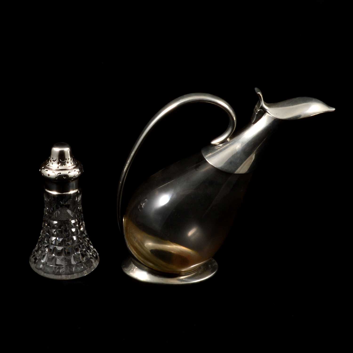 Lot 391 - Cut glass caster with silver mount and a novelty claret jug with plated mounts