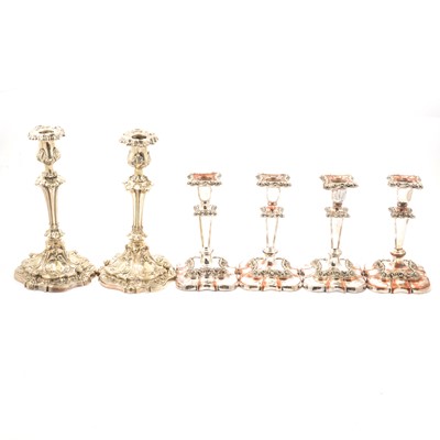 Lot 279 - Pair of silver plated candlesticks and a set of four silver plated candlesticks