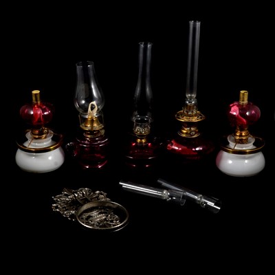 Lot 152 - Collection of cranberry glass and brass oil lamps