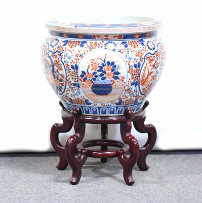 Lot 171 - Japanese Imari jardiniere on a hardwood stand