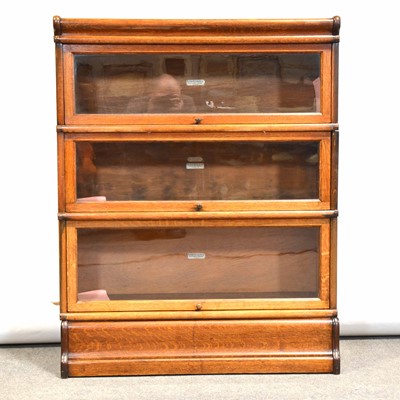 Lot 663 - An oak three section Globe Wernicke sectional bookcase