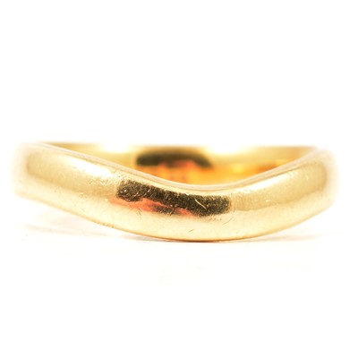 Lot 35 - An 18 carat yellow gold wedding band.