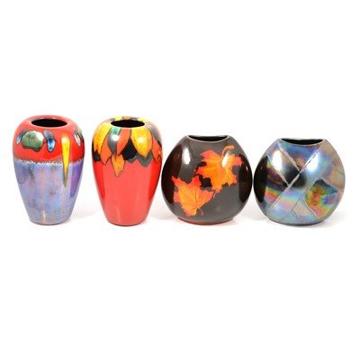Lot 26 - Seven Poole Pottery brightly coloured vases and one other.
