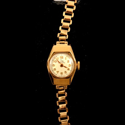 Lot 211 - Record - a lady's 9 carat yellow gold bracelet watch.