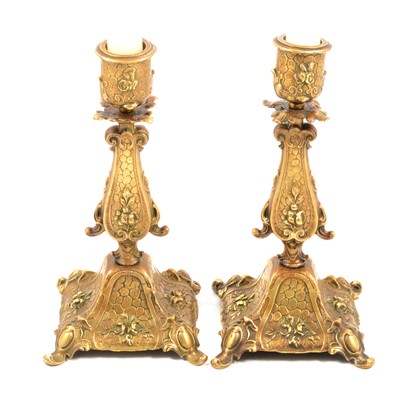 Lot 80 - Pair of cast brass candlesticks, early 20th century