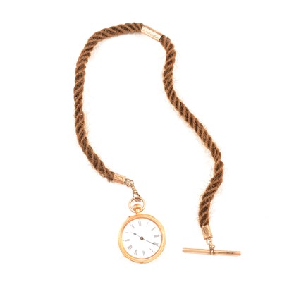 Lot 143 - An 18k open face fob watch on a natural hair Albert.