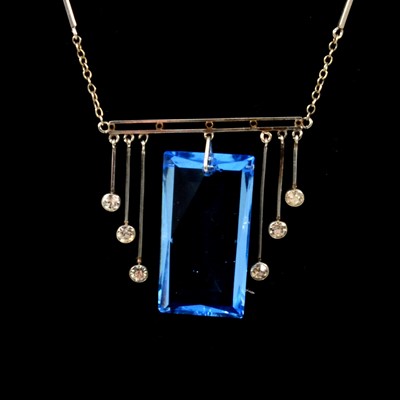 Lot 375 - A blue paste crystal pendant and chain in the Art Deco style.