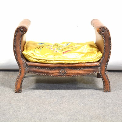 Lot 435 - An early 20th century leather covered wooden footstool