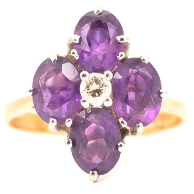 Lot 30 - An amethyst and diamond dress ring.