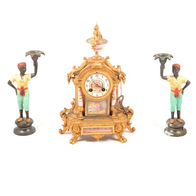 Lot 90 - French gilt spelter and porcelain mantel clock, and a pair of spelter candlesticks